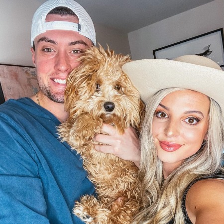 Ryleigh Vertes and her husband Kade McClure with their dog Truly.